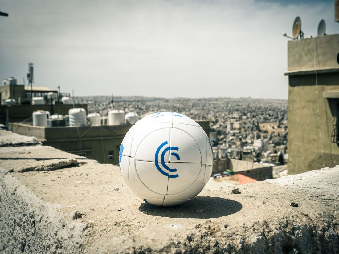 Rubik's ball with MSC logo, in the background there is Amman.